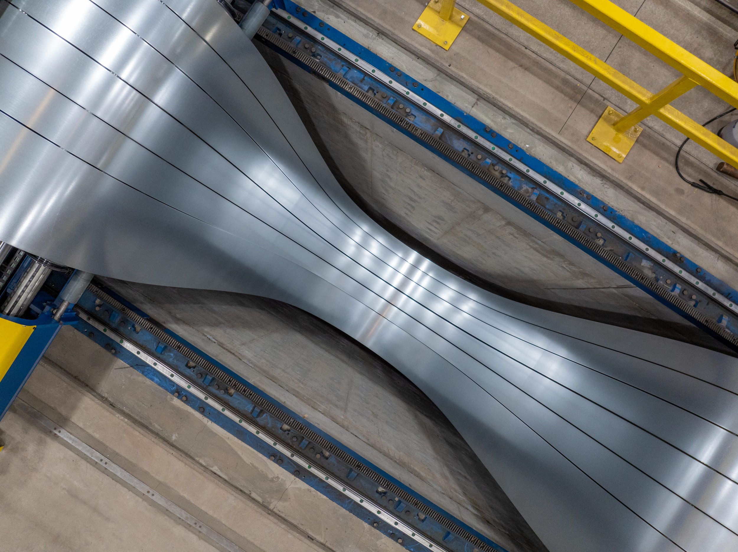 Slitting process in a metal facility